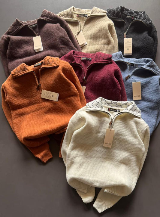 Gucci half‑zip knit sweaters with monogram collars